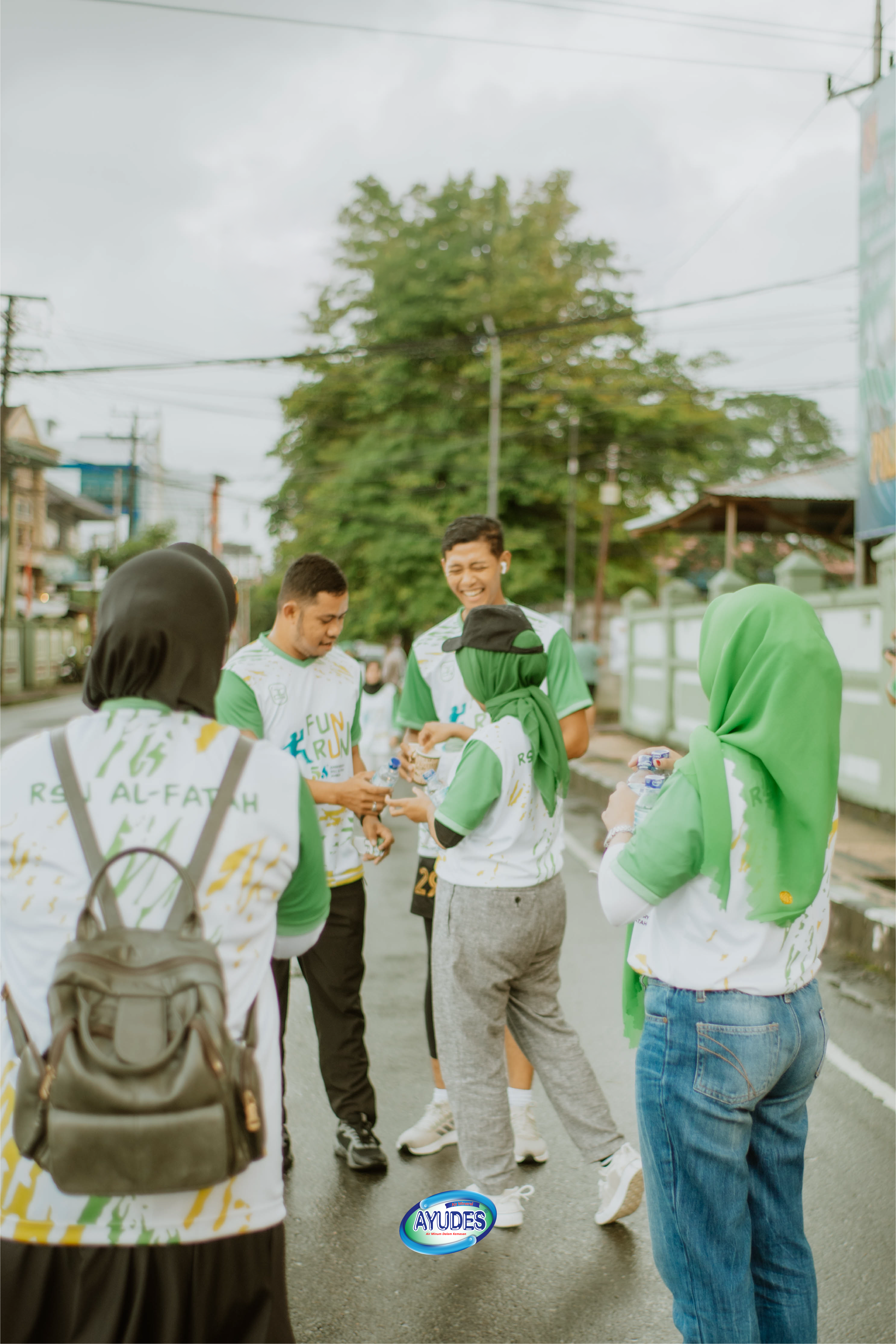 People drinking Ayudes water